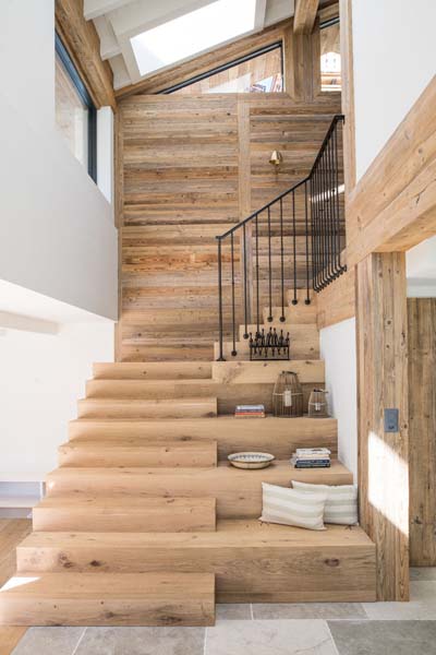 Reclaimed boards and beams in alps house interior