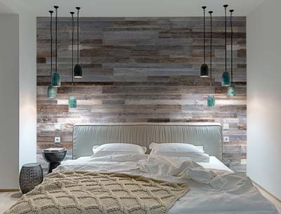 Bedroom wall covered with wood boards in grey color