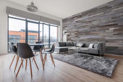 Wall panel in apartment with large windows 