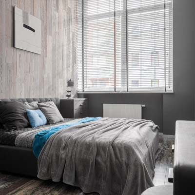 Grey bedroom with blue elements
