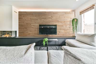 Oak 3d wall behind tv black sideboard