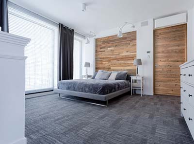 Reclaimed wood wall behind bed and in doors 