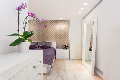 Violet bedroom interior with wall panels 