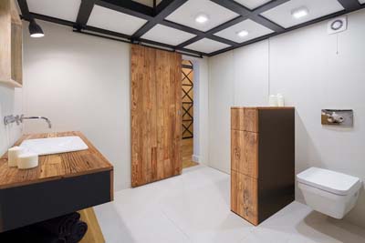 wood doors in bathroom interior with black elements 