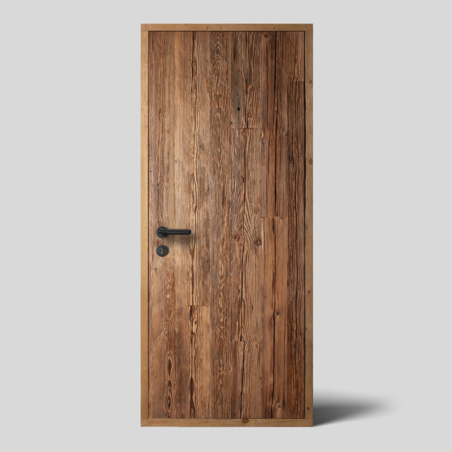 door surface made from reclaimed hand-hewn sun burned wood