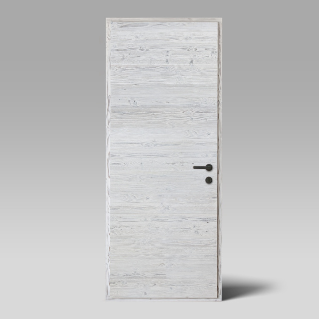 surface de porte en vieux bois avec une finition blanchie à la chaux